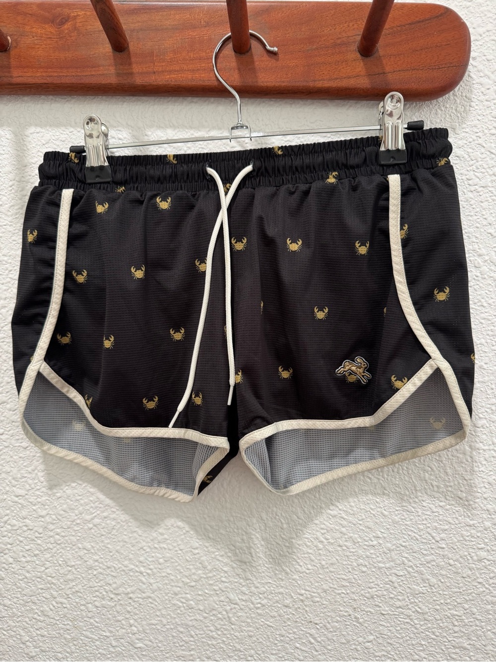 Tracksmith Black Athletic Shorts with Cream Trim and Gold Crab Detail